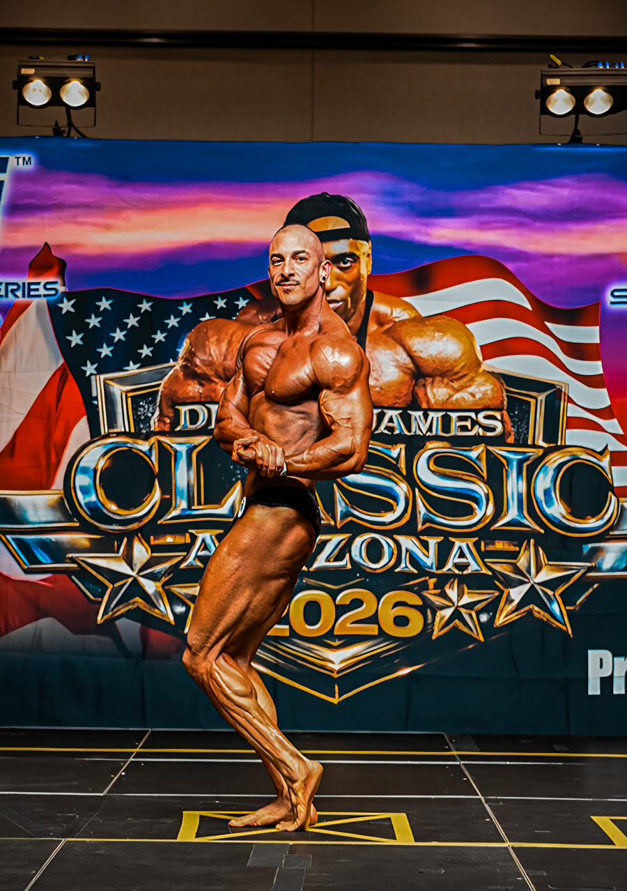 Adam Solis side chest pose on stage